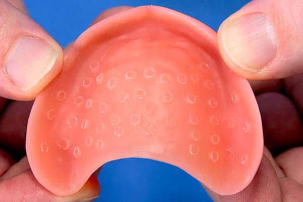 Suction cup dentures – a non-invasive denture process - North Street Dental